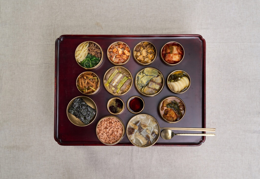 Traditional Joseon yangban aristocrat seasonal dining table showing 9-dish arrangement with regional ingredients : Spring