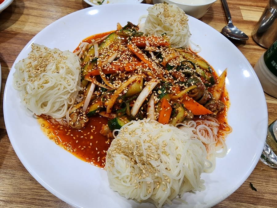 Golbaengi muchim (Korean sea snail salad) with spicy gochujang sauce, somyeon noodles, and vegetables - Korea's most popular drinking snack