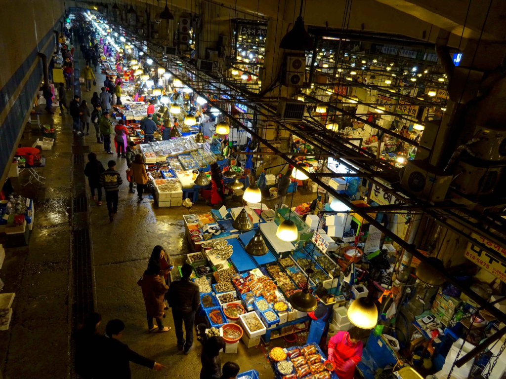 Noryangjin fish market in Seoul where tourists can try fresh sannakji at restaurants and seafood stalls