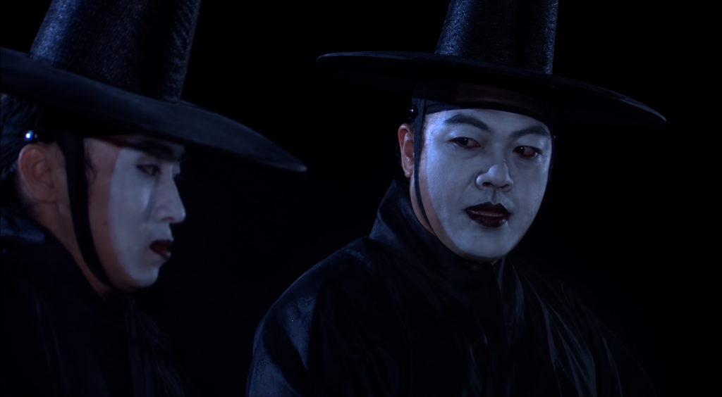 Close-up of a jeoseung saja with a pale face and dark lips in Legend of the Hometown