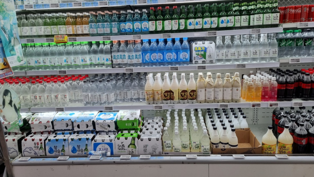 Rows of nearly identical green soju bottles on a Korean supermarket shelf